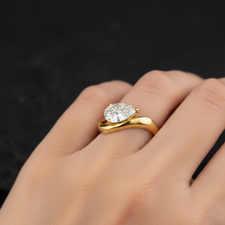 exquisite pear cut 2ct diamond engagement ring in gold setting