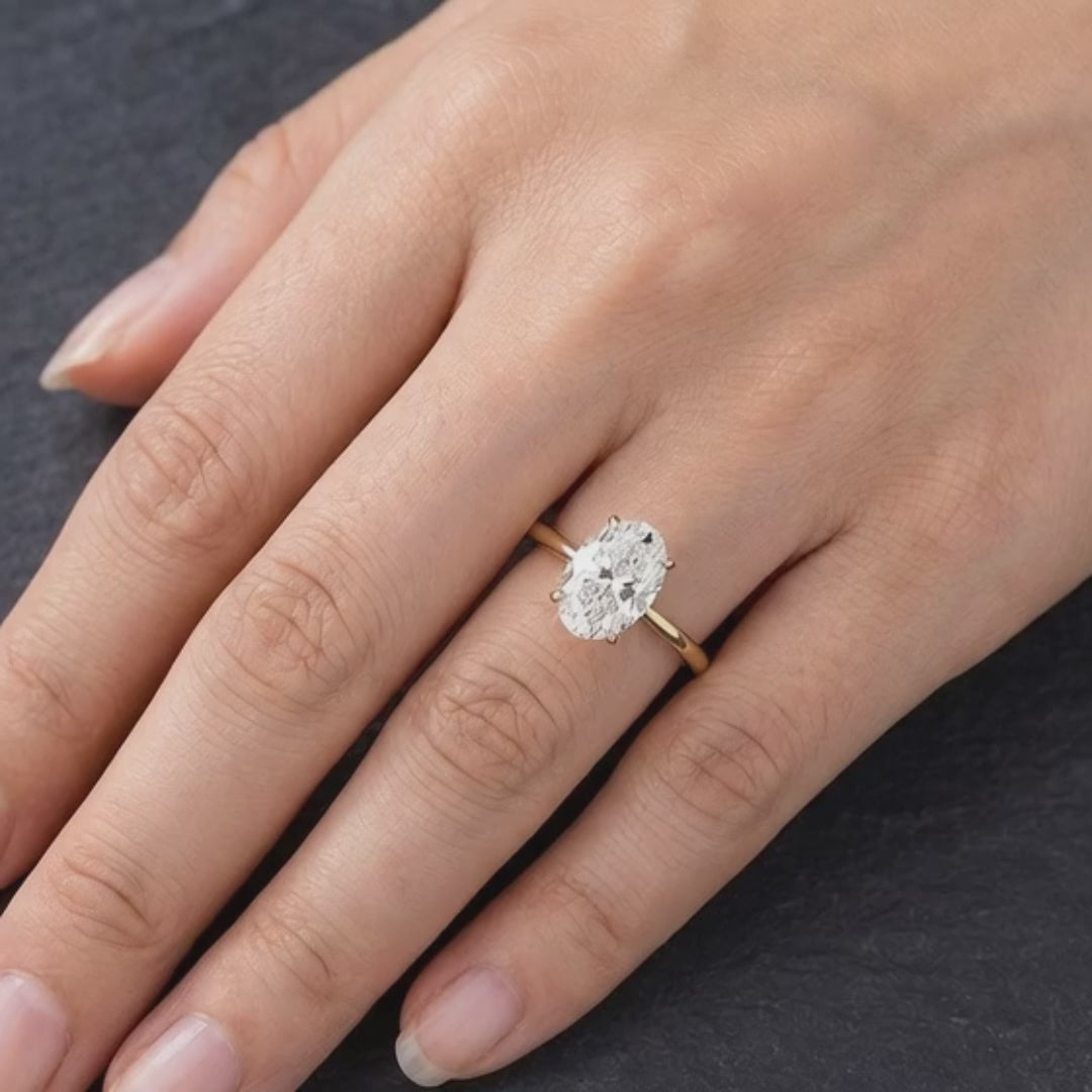 Handcrafted oval 3 Karat diamond engagement ring in 18K gold setting